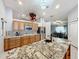 Gourmet kitchen boasting granite island and stainless steel appliances at 1725 Singing Palm Dr, Apopka, FL 32712
