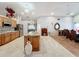 Open kitchen with large island and views to dining area at 1725 Singing Palm Dr, Apopka, FL 32712