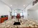 Kitchen with granite countertop island overlooking dining room at 1725 Singing Palm Dr, Apopka, FL 32712