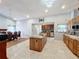 Open concept kitchen with large island and granite countertops at 1725 Singing Palm Dr, Apopka, FL 32712