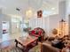 Elegant living room featuring a formal sitting area with ornate furniture at 1725 Singing Palm Dr, Apopka, FL 32712