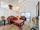 Elegant living room featuring ornate furniture and a view to the sunroom at 1725 Singing Palm Dr, Apopka, FL 32712