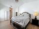 Spacious main bedroom with a large bed and walk-in closet at 1725 Singing Palm Dr, Apopka, FL 32712