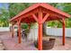 Relaxing pergola with seating area and string lights at 1725 Singing Palm Dr, Apopka, FL 32712