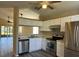 Modern kitchen with stainless steel appliances and light-colored cabinets at 2168 Meadow Ct, Apopka, FL 32703