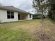 Home with covered patio and grassy backyard at 3041 Adrian Dr, Ormond Beach, FL 32174