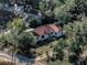 House nestled in a quiet, tree-lined neighborhood at 3250 Mountain Lake Cutoff Rd, Lake Wales, FL 33859