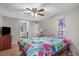 Spacious bedroom with a ceiling fan and large bed at 3250 Mountain Lake Cutoff Rd, Lake Wales, FL 33859