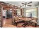 Rustic dining area with brick wall and built in bench seating at 3250 Mountain Lake Cutoff Rd, Lake Wales, FL 33859