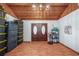 Bright entryway with double doors and wood paneled ceiling at 3250 Mountain Lake Cutoff Rd, Lake Wales, FL 33859