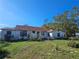 Ranch style home with red tile roof and a spacious yard at 3250 Mountain Lake Cutoff Rd, Lake Wales, FL 33859