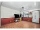 Living room with hardwood floors and a flatscreen TV at 3250 Mountain Lake Cutoff Rd, Lake Wales, FL 33859