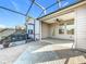 Large backyard patio with screened enclosure, ideal for outdoor living at 349 Alcove Dr, Groveland, FL 34736