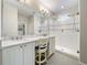 Elegant bathroom with double vanity, quartz countertop and large shower at 349 Alcove Dr, Groveland, FL 34736