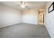 Spacious bedroom with ceiling fan and carpet flooring at 349 Alcove Dr, Groveland, FL 34736
