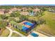 Tennis and pickleball courts with a basketball court nearby at 349 Alcove Dr, Groveland, FL 34736