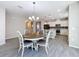 Open concept dining area with kitchen view and breakfast bar at 349 Alcove Dr, Groveland, FL 34736
