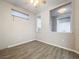 Spacious dining area with wood-look flooring and a view into the kitchen at 349 Alcove Dr, Groveland, FL 34736