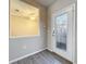 Bright and airy entryway with wood-look tile flooring and a view into the living area at 349 Alcove Dr, Groveland, FL 34736