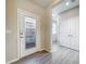 Bright entryway with glass-paneled door and tile flooring at 349 Alcove Dr, Groveland, FL 34736