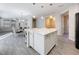 Spacious kitchen with island, stainless steel appliances, and white cabinets at 349 Alcove Dr, Groveland, FL 34736