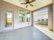 Screened porch with two windows and a door at 349 Alcove Dr, Groveland, FL 34736