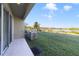Backyard patio with lake view and grassy area at 470 Lake Shore Pkwy, Davenport, FL 33896
