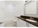 Bathroom with shower/tub combo and white cabinets at 470 Lake Shore Pkwy, Davenport, FL 33896