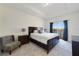 Main bedroom with water view and private balcony at 470 Lake Shore Pkwy, Davenport, FL 33896