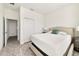 Bedroom with king-size bed and access to a hallway at 470 Lake Shore Pkwy, Davenport, FL 33896