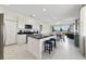 Modern kitchen with white cabinets, granite countertops, and an island at 470 Lake Shore Pkwy, Davenport, FL 33896