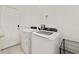 Bright laundry room with washer, dryer, and storage at 470 Lake Shore Pkwy, Davenport, FL 33896