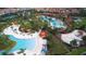 Community pool and playground with surrounding homes at 7400 Oakmoss Loop, Davenport, FL 33837