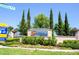 Resort entrance with landscaping and signage at 7400 Oakmoss Loop, Davenport, FL 33837
