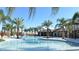Expansive resort-style pool with surrounding cabanas at 7400 Oakmoss Loop, Davenport, FL 33837