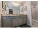 Double vanity bathroom with granite countertop at 7400 Oakmoss Loop, Davenport, FL 33837
