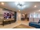 Fun game room featuring a large sectional sofa, TV, and game tables at 7400 Oakmoss Loop, Davenport, FL 33837