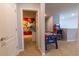 Game room with air hockey, arcade game, and Mickey Mouse decor at 7400 Oakmoss Loop, Davenport, FL 33837