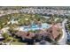 Resort-style community pool with expansive deck and waterslide at 7400 Oakmoss Loop, Davenport, FL 33837