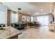 Open concept dining room with a modern table and chairs at 7400 Oakmoss Loop, Davenport, FL 33837