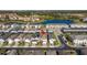 Aerial view showing the home's location in a neighborhood with a lake at 7400 Oakmoss Loop, Davenport, FL 33837