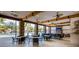 Indoor community room with seating and large windows overlooking the pool at 7400 Oakmoss Loop, Davenport, FL 33837