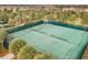 Two well-maintained tennis courts in a community setting at 7400 Oakmoss Loop, Davenport, FL 33837