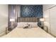 Spacious bedroom with a plush bed and geometric wallpaper at 7400 Oakmoss Loop, Davenport, FL 33837