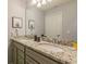 Bathroom with double vanity and granite countertop at 7400 Oakmoss Loop, Davenport, FL 33837