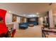 Game room with sectional sofa, arcade game, and air hockey table at 7400 Oakmoss Loop, Davenport, FL 33837