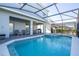 Covered patio with table, chairs, and lounge chairs at 7400 Oakmoss Loop, Davenport, FL 33837