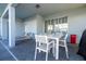 Outdoor patio area with seating and a dining table at 7400 Oakmoss Loop, Davenport, FL 33837