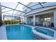 Inviting screened pool and spa with patio area at 7400 Oakmoss Loop, Davenport, FL 33837