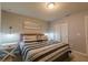 Spacious bedroom with a king-size bed and stylish decor at 7400 Oakmoss Loop, Davenport, FL 33837